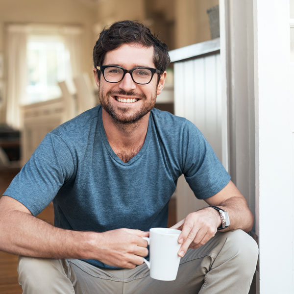 man in glasses smiling