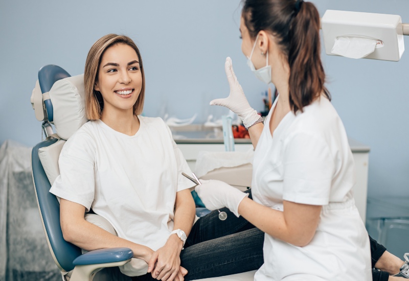 A patient consults a dentist for a general dental checkup during a clinic visit in St. Louis, MO
